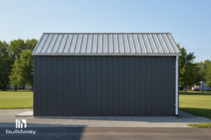 Custom-Built Small Steel Garage 4 Side elevation of the gray steel garage showing the durable wall panels and sloped metal roof.