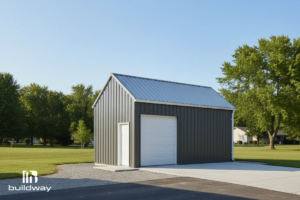 Custom-Built Small Steel Garage 5 Angled exterior view of the garage displaying the roll-up door and concrete driveway under a clear sky.