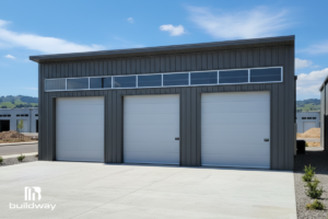 Become a Builder 2 Modern steel building with three large garage doors and sleek design, built by Buildway.