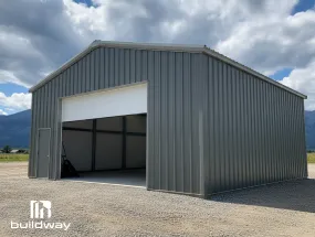 Angled view of a steel building with an installed white service door frame, showcasing Buildway’s CFS door framing system.
