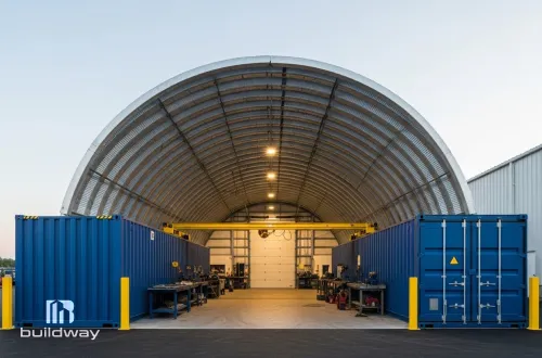 Spacious steel industrial workshop with arched roofing and side storage areas, built by Buildway. Designed for heavy-duty work and long-term durability.